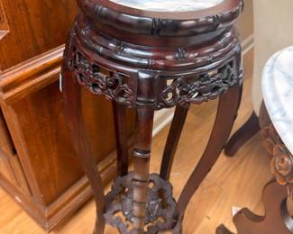Antique carved dark wood marble-top plant stand with ornate fretwork, Victorian pedestal