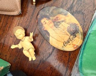 Vintage Coca-Cola advertising pocket mirror, ceramic cherub figurine