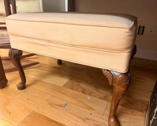 Upholstered ottoman footstool, cream striped fabric, carved wood legs