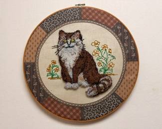Vintage cross-stitch needlepoint cat in embroidery hoop, handmade textile art