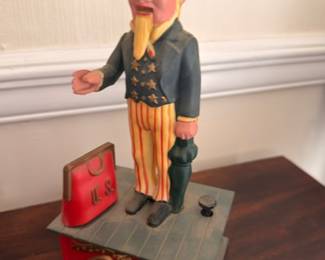 Vintage cast iron Uncle Sam mechanical bank, collectible coin bank