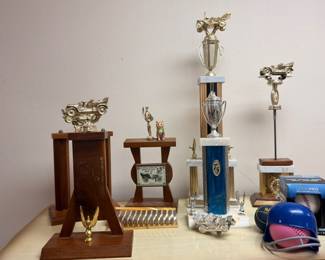 Vintage car racing trophies, miniature wood table, baseball batting helmet