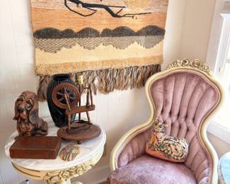 Vintage pink velvet Victorian parlor chair, antique spinning wheel, woven wall hanging