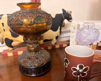 Vintage painted glass oil lamp, black cow figurine, pink floral ceramic mugs