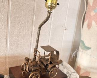 Vintage brass antique car novelty table lamp on wooden base