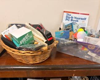 Assorted books, office supplies, household items lot in basket