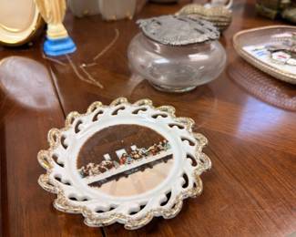 Decorative scalloped edge plate with scenic center, clear glass rose bowl, collectible trinkets