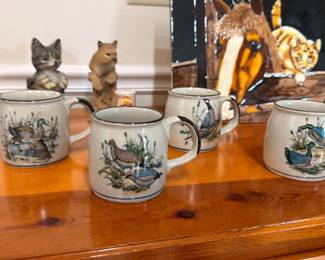 Ceramic cat figurines, wildlife scene coffee mugs, collectible animal decor