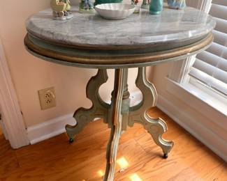 Antique marble-top round side table with ornate carved base