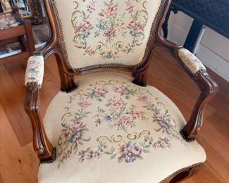 Antique Victorian armchair with floral needlepoint upholstery, carved wood frame