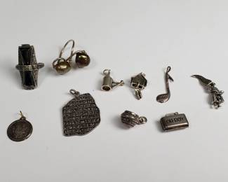  Silver pendants, charms, and two rings – one with Tahitian pearls. Scratch-tested