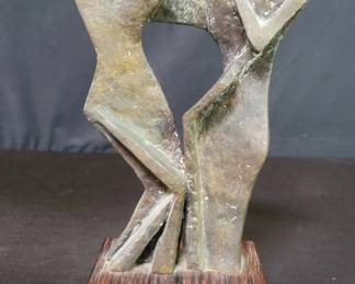 Vintage bronze abstract sculpture on a wood base