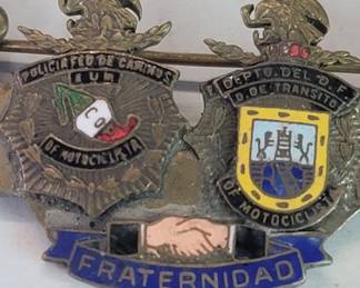 Vintage enamel on bronze Mexican police and transit insignia with the word "Fraternity" in Spanish
