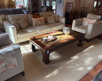 Upholstered furnishings and vintage Ming style coffee table with woven seagrass top