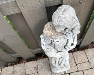#129	concrete Saint w/Flowers (head detached) - 32" Tall	 $30.00 			