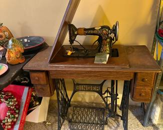 #61	Singer Model 66 in Tredle Sewing Cabinet on Wheels (has 4 drawers with misc. sewing parts) - UpStairs you move down	 $150.00 			