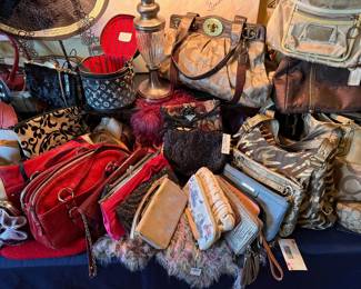 Assorted purses wallets and handbags