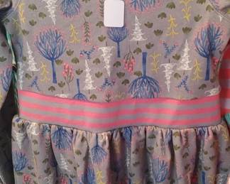 Matilda Jane Around Town Dress from the "Make Believe" collection is a fleece-lined gray dress featuring a tree pattern and pink trim. 