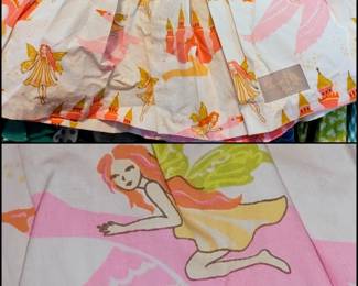Eleanor Rose brand "Swan Princess" dress, featuring a yellow quatrefoil pattern top with ruffle details and a white skirt patterned with fairies and castles. 