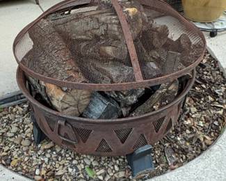 Rustic Steel Fire Pit with Decorative Cutouts and Mesh Spark Screen