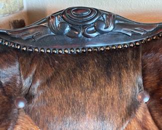 Two Western-style wingback chairs upholstered in top-grain tobacco leather, and one with brindle hair-on-hide.