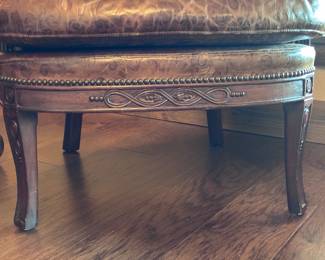 Two Western-style wingback chairs upholstered in top-grain tobacco leather, and one with brindle hair-on-hide.