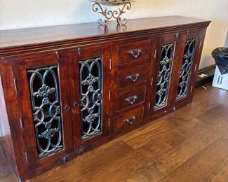 Rustic wooden buffet with iron doors