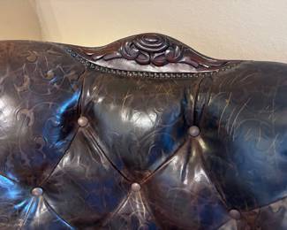 Two Western-style wingback chairs upholstered in top-grain tobacco leather, and one with brindle hair-on-hide.