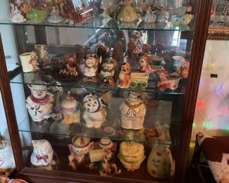 Many cookie jars and antique planters 
