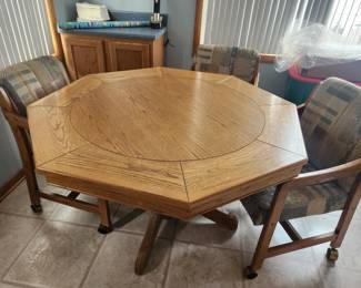 Dining table and 4 chairs. Table top reverses to poker table top