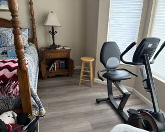 stationary bike, nightstands, lamps