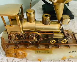DeMott brass and stone train engine