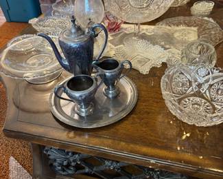Lots of silver and tea sets. 