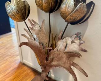 Metal floor sculpture of tulips.