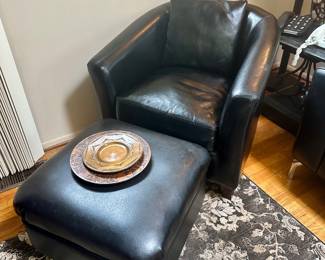 Barrel back leather chair & ottoman.