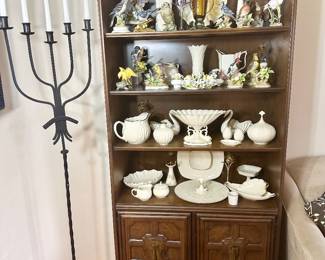 Book/display cabinet filled with Lenox and porcelain birds.