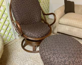 Rattan swivel chair with ottoman.