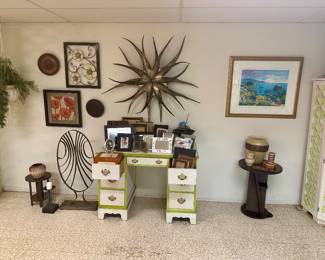 Green & white kneehole desk & large metal sunburst wall hanging.