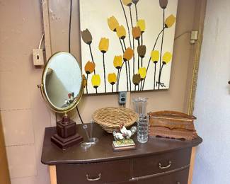 Dresser, oval table mirror & tulip artwork.