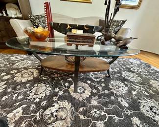 Oval glass top coffee table.