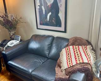 Black leather loveseat.