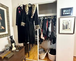 One of 4 closets filled with women's clothing.