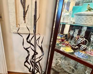 Artisan made large metal cattail sculpture.