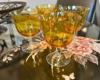 Amber stemmed glassware.