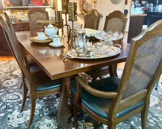 Beautiful wood dining table with 6 chairs, one leaf and custom pads.