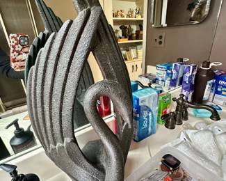 Stylized swan figure.