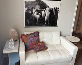 White loveseat and side table