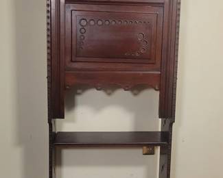 Lot # : 8 - Mahogany Drop Front Secretary Desk Mahogany secretary desk measuring 22.5´´ x 11 x 57´´ tall featuring a drop front with circular inlay details, interior compartments, and a beveled mirror. Includes two lower shelves and a scrolled leg design. Comes with a brass key. Some surface wear and scratches are visible.