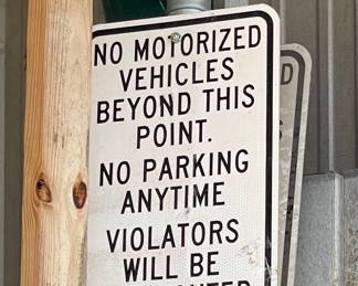 “NO MOTORIZED VEHICLES BEYOND THIS POINT” SIGN