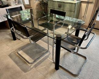 Made in Europe, licensed reproduction of Mart Stamm leather and steel chairs with glass top table